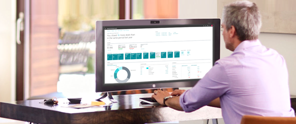 man at computer using jewelry software after migration
